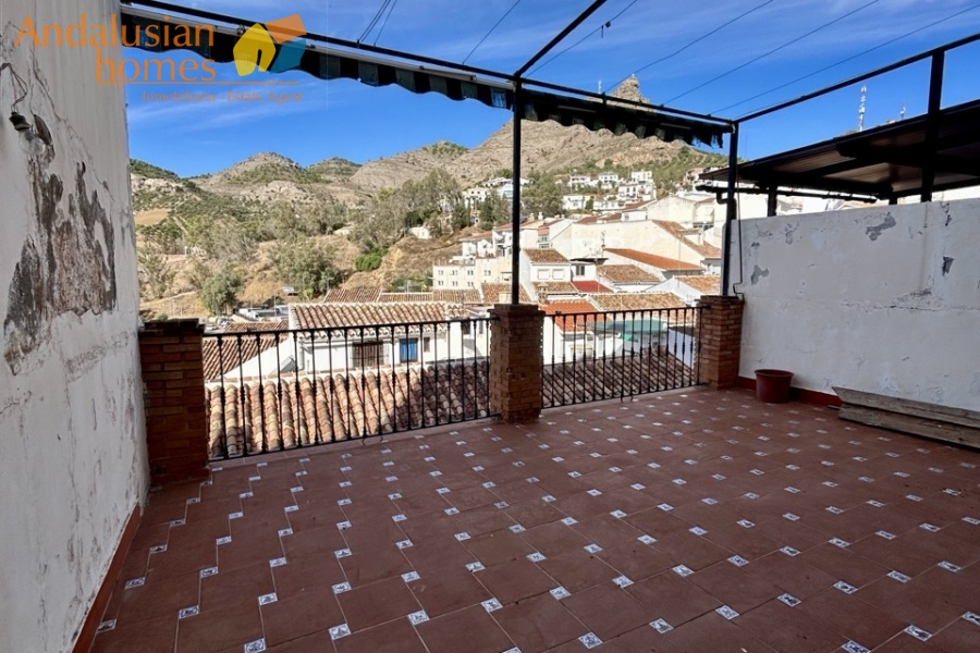 historic townhouse, Andalusian property, townhouse for sale Spain, renovation project, investment property, boutique hotel potential, town square property, property with terraces, garage included, mountain views, character building, development opportunity, rental potential
