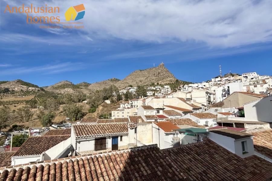 historic townhouse, Andalusian property, townhouse for sale Spain, renovation project, investment property, boutique hotel potential, town square property, property with terraces, garage included, mountain views, character building, development opportunity, rental potential