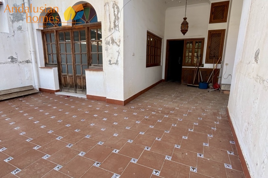 historic townhouse, Andalusian property, townhouse for sale Spain, renovation project, investment property, boutique hotel potential, town square property, property with terraces, garage included, mountain views, character building, development opportunity, rental potential