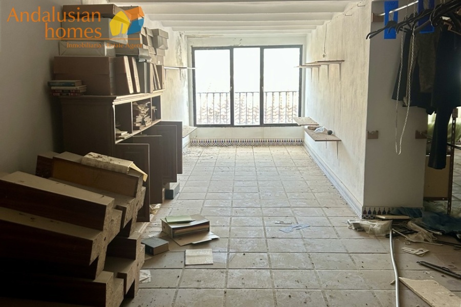 historic townhouse, Andalusian property, townhouse for sale Spain, renovation project, investment property, boutique hotel potential, town square property, property with terraces, garage included, mountain views, character building, development opportunity, rental potential