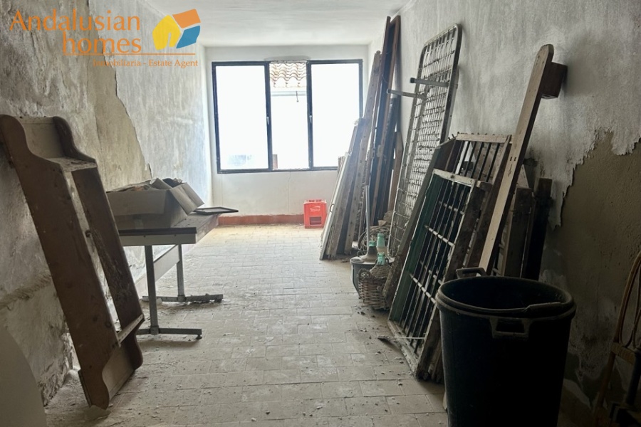 historic townhouse, Andalusian property, townhouse for sale Spain, renovation project, investment property, boutique hotel potential, town square property, property with terraces, garage included, mountain views, character building, development opportunity, rental potential