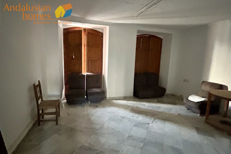 historic townhouse, Andalusian property, townhouse for sale Spain, renovation project, investment property, boutique hotel potential, town square property, property with terraces, garage included, mountain views, character building, development opportunity, rental potential