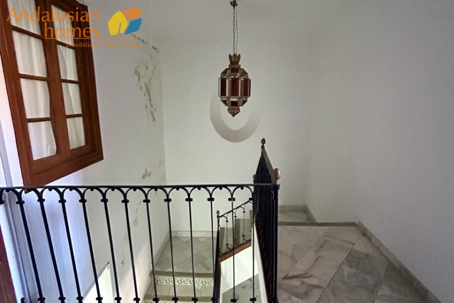 historic townhouse, Andalusian property, townhouse for sale Spain, renovation project, investment property, boutique hotel potential, town square property, property with terraces, garage included, mountain views, character building, development opportunity, rental potential
