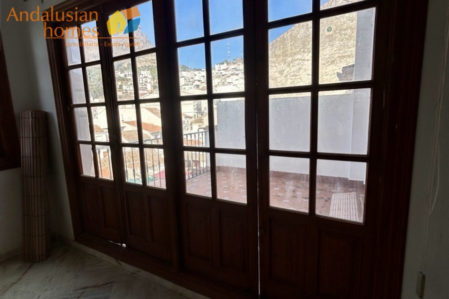 historic townhouse, Andalusian property, townhouse for sale Spain, renovation project, investment property, boutique hotel potential, town square property, property with terraces, garage included, mountain views, character building, development opportunity, rental potential