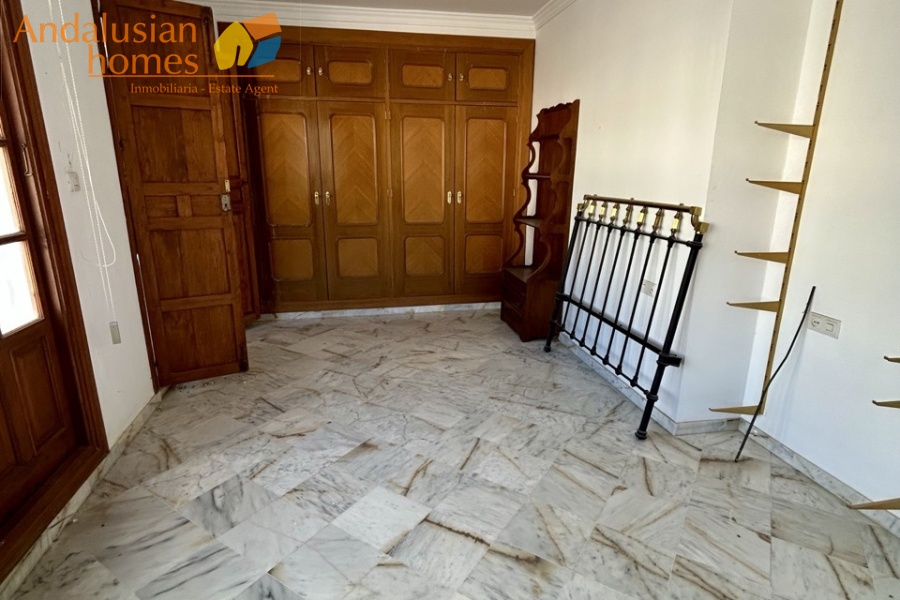 historic townhouse, Andalusian property, townhouse for sale Spain, renovation project, investment property, boutique hotel potential, town square property, property with terraces, garage included, mountain views, character building, development opportunity, rental potential