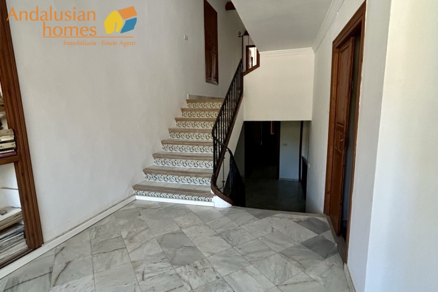 historic townhouse, Andalusian property, townhouse for sale Spain, renovation project, investment property, boutique hotel potential, town square property, property with terraces, garage included, mountain views, character building, development opportunity, rental potential