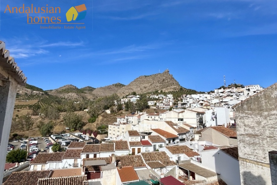 historic townhouse, Andalusian property, townhouse for sale Spain, renovation project, investment property, boutique hotel potential, town square property, property with terraces, garage included, mountain views, character building, development opportunity, rental potential