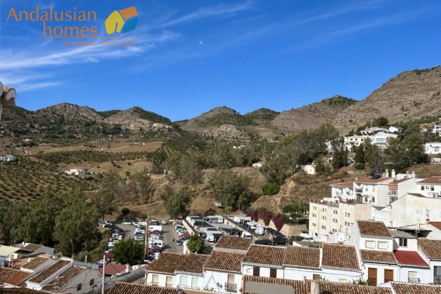 historic townhouse, Andalusian property, townhouse for sale Spain, renovation project, investment property, boutique hotel potential, town square property, property with terraces, garage included, mountain views, character building, development opportunity, rental potential