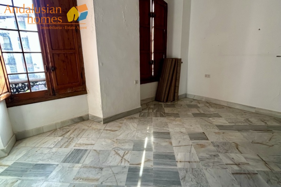 historic townhouse, Andalusian property, townhouse for sale Spain, renovation project, investment property, boutique hotel potential, town square property, property with terraces, garage included, mountain views, character building, development opportunity, rental potential