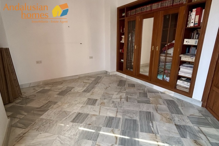 historic townhouse, Andalusian property, townhouse for sale Spain, renovation project, investment property, boutique hotel potential, town square property, property with terraces, garage included, mountain views, character building, development opportunity, rental potential