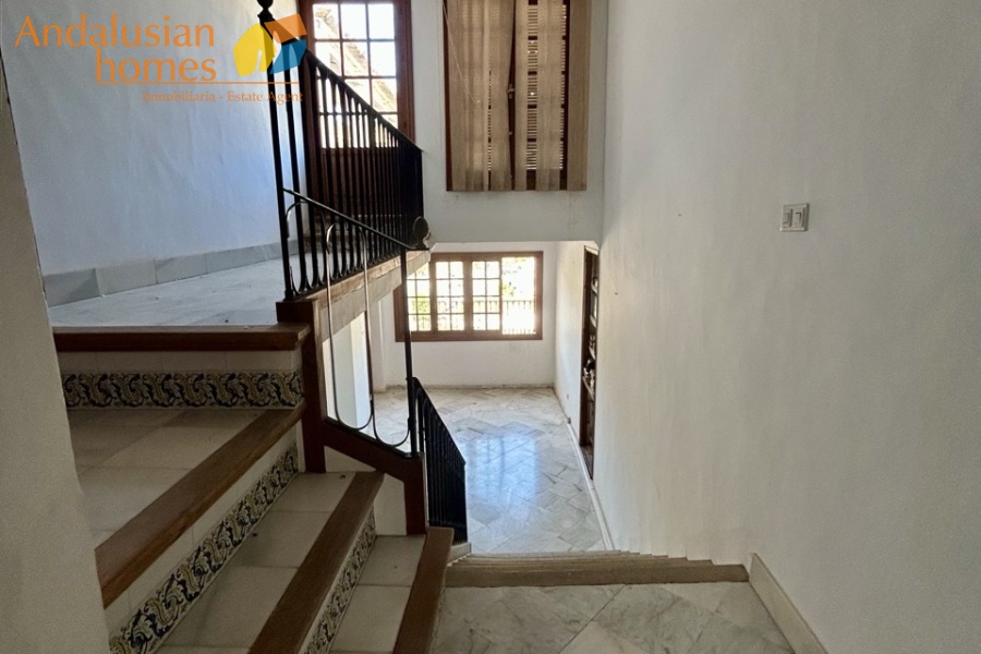 historic townhouse, Andalusian property, townhouse for sale Spain, renovation project, investment property, boutique hotel potential, town square property, property with terraces, garage included, mountain views, character building, development opportunity, rental potential
