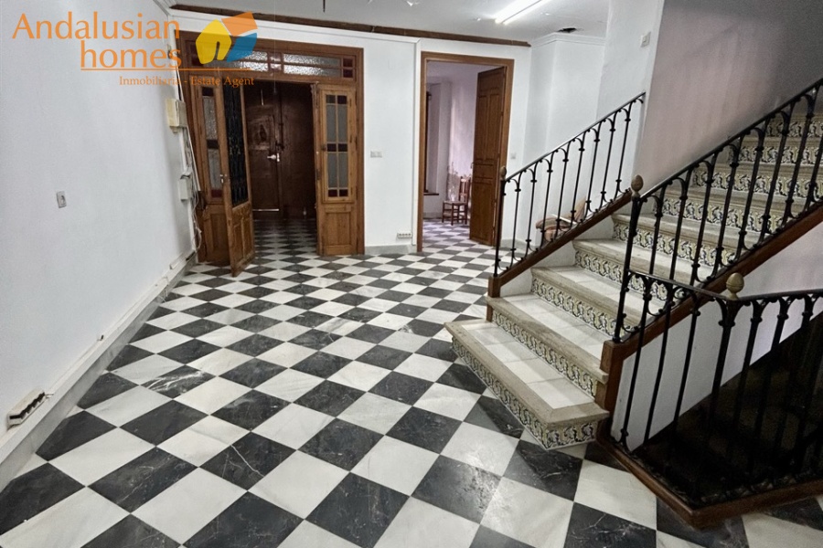 historic townhouse, Andalusian property, townhouse for sale Spain, renovation project, investment property, boutique hotel potential, town square property, property with terraces, garage included, mountain views, character building, development opportunity, rental potential