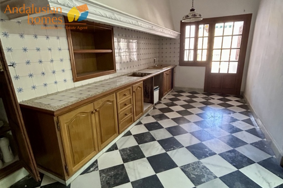 historic townhouse, Andalusian property, townhouse for sale Spain, renovation project, investment property, boutique hotel potential, town square property, property with terraces, garage included, mountain views, character building, development opportunity, rental potential