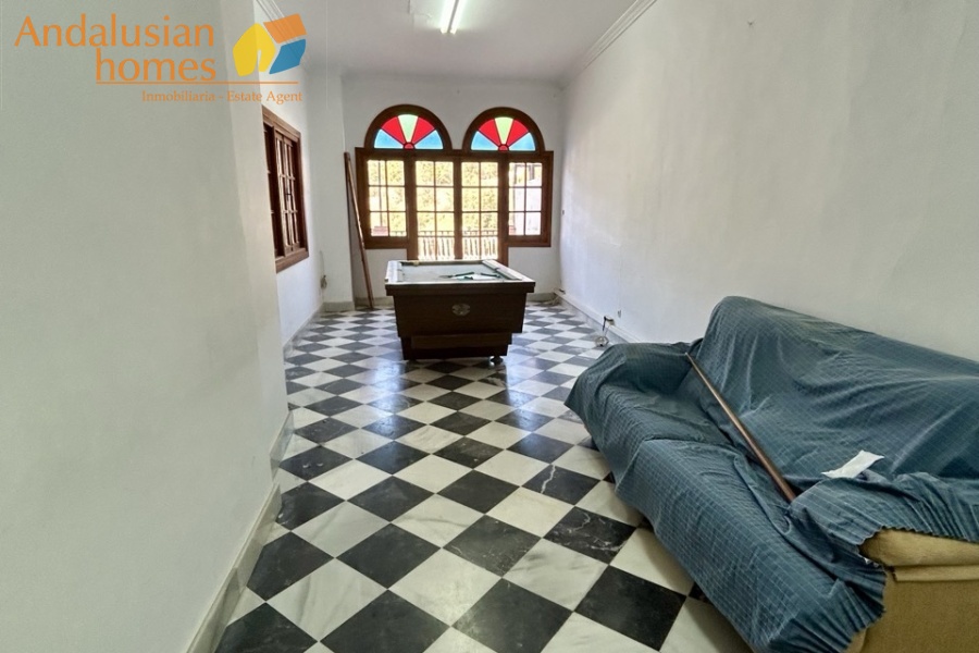 historic townhouse, Andalusian property, townhouse for sale Spain, renovation project, investment property, boutique hotel potential, town square property, property with terraces, garage included, mountain views, character building, development opportunity, rental potential
