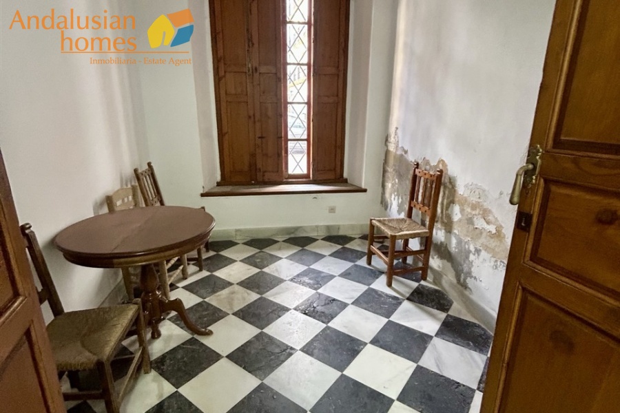 historic townhouse, Andalusian property, townhouse for sale Spain, renovation project, investment property, boutique hotel potential, town square property, property with terraces, garage included, mountain views, character building, development opportunity, rental potential
