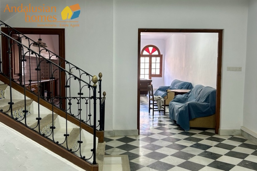 historic townhouse, Andalusian property, townhouse for sale Spain, renovation project, investment property, boutique hotel potential, town square property, property with terraces, garage included, mountain views, character building, development opportunity, rental potential