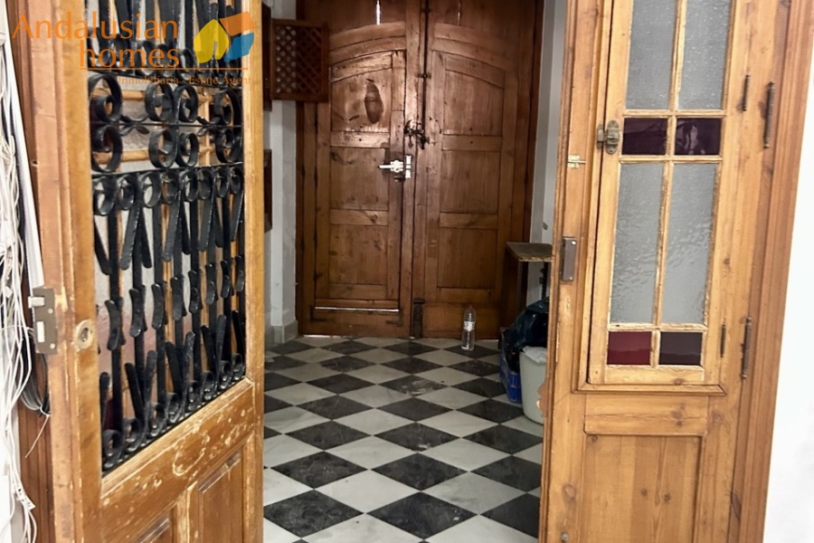historic townhouse, Andalusian property, townhouse for sale Spain, renovation project, investment property, boutique hotel potential, town square property, property with terraces, garage included, mountain views, character building, development opportunity, rental potential