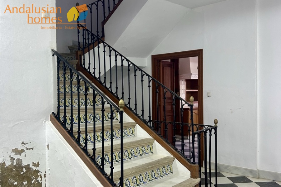 historic townhouse, Andalusian property, townhouse for sale Spain, renovation project, investment property, boutique hotel potential, town square property, property with terraces, garage included, mountain views, character building, development opportunity, rental potential