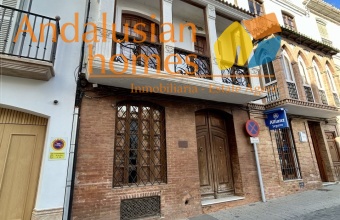 historic townhouse, Andalusian property, townhouse for sale Spain, renovation project, investment property, boutique hotel potential, town square property, property with terraces, garage included, mountain views, character building, development opportunity, rental potential