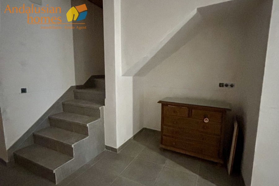 Open plan reception room with stairs up