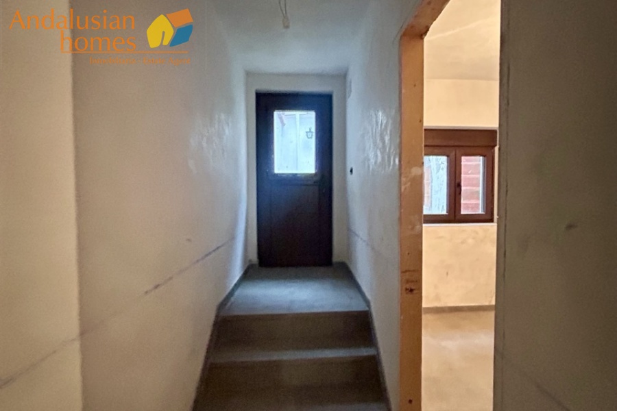 Hallway to back door and kitchen