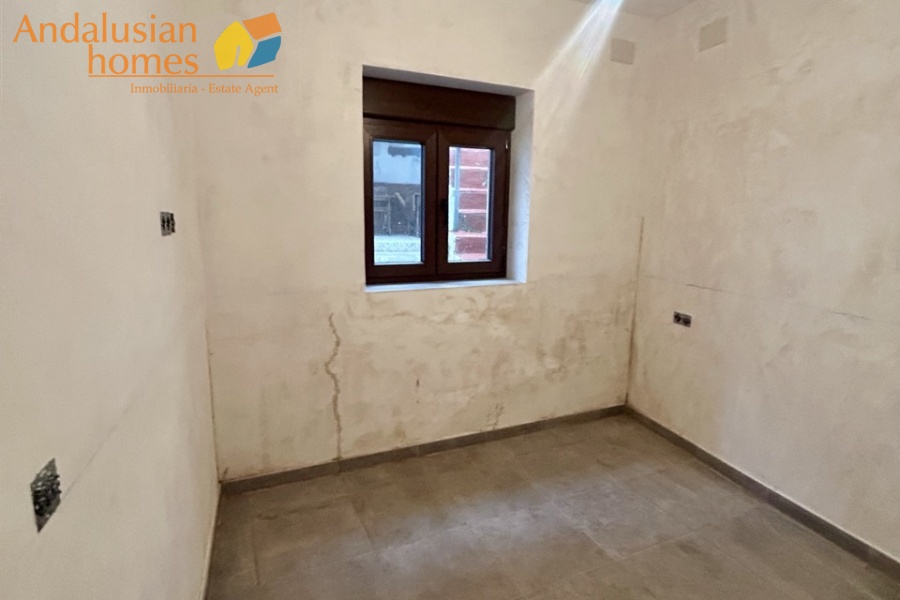 Newly refurbished room, ideal for installation of kitchen, window looking out to patio