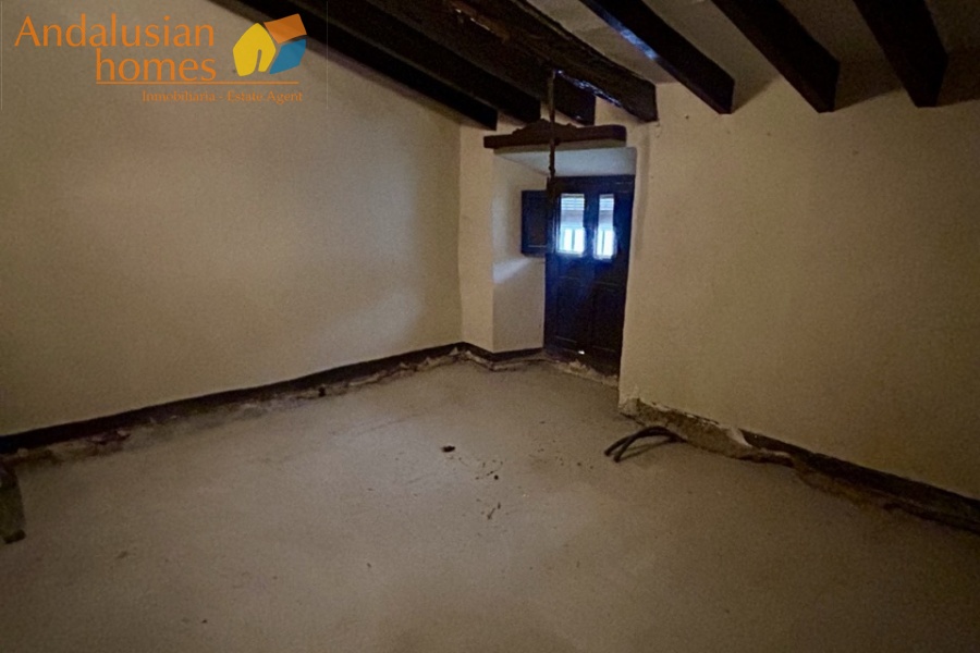 Front Bedroom with sloping beamed ceiling 