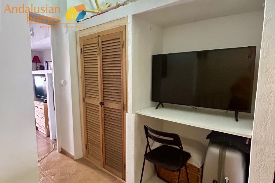 Landing area with sitting area, desk space and storage 