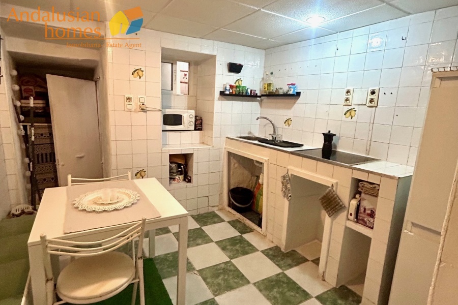 Tiled kitchen with space for table
