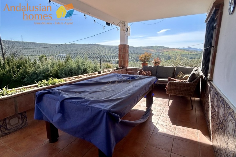 Country home, Álora, Las Mellizas, Málaga countryside, detached villa, olive grove, 4000m2 plot, private pool, panoramic views, terraces, fenced plot, parking, fireplace, ensuite bedroom, outdoor living, rural retreat, train access, investment property, holiday rental, tourism potential, Andalusian property, peaceful location, close to El Chorro, near Málaga coast