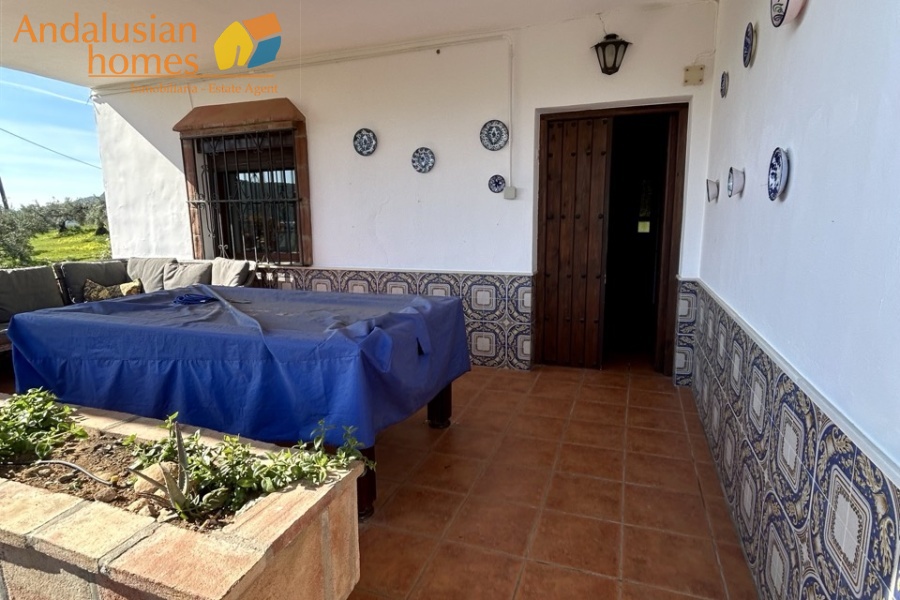 Country home, Álora, Las Mellizas, Málaga countryside, detached villa, olive grove, 4000m2 plot, private pool, panoramic views, terraces, fenced plot, parking, fireplace, ensuite bedroom, outdoor living, rural retreat, train access, investment property, holiday rental, tourism potential, Andalusian property, peaceful location, close to El Chorro, near Málaga coast