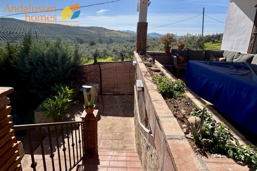 Country home, Álora, Las Mellizas, Málaga countryside, detached villa, olive grove, 4000m2 plot, private pool, panoramic views, terraces, fenced plot, parking, fireplace, ensuite bedroom, outdoor living, rural retreat, train access, investment property, holiday rental, tourism potential, Andalusian property, peaceful location, close to El Chorro, near Málaga coast