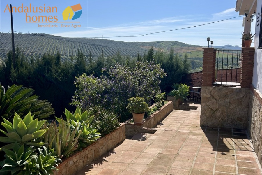 Country home, Álora, Las Mellizas, Málaga countryside, detached villa, olive grove, 4000m2 plot, private pool, panoramic views, terraces, fenced plot, parking, fireplace, ensuite bedroom, outdoor living, rural retreat, train access, investment property, holiday rental, tourism potential, Andalusian property, peaceful location, close to El Chorro, near Málaga coast