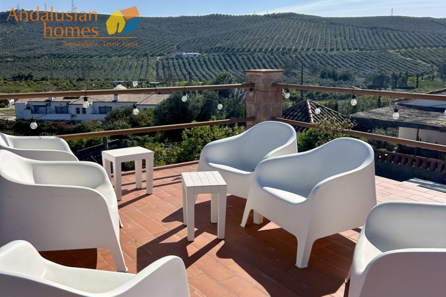 Country home, Álora, Las Mellizas, Málaga countryside, detached villa, olive grove, 4000m2 plot, private pool, panoramic views, terraces, fenced plot, parking, fireplace, ensuite bedroom, outdoor living, rural retreat, train access, investment property, holiday rental, tourism potential, Andalusian property, peaceful location, close to El Chorro, near Málaga coast