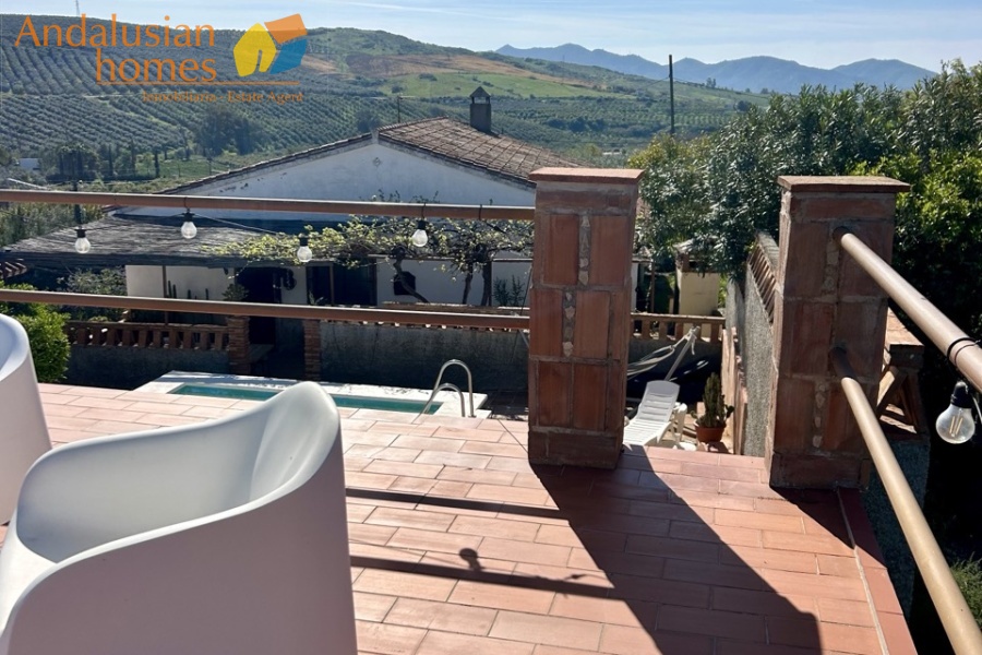 Country home, Álora, Las Mellizas, Málaga countryside, detached villa, olive grove, 4000m2 plot, private pool, panoramic views, terraces, fenced plot, parking, fireplace, ensuite bedroom, outdoor living, rural retreat, train access, investment property, holiday rental, tourism potential, Andalusian property, peaceful location, close to El Chorro, near Málaga coast
